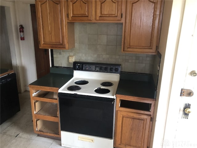 kitchen with light tile patterned floors, tasteful backsplash, brown cabinets, and electric stove