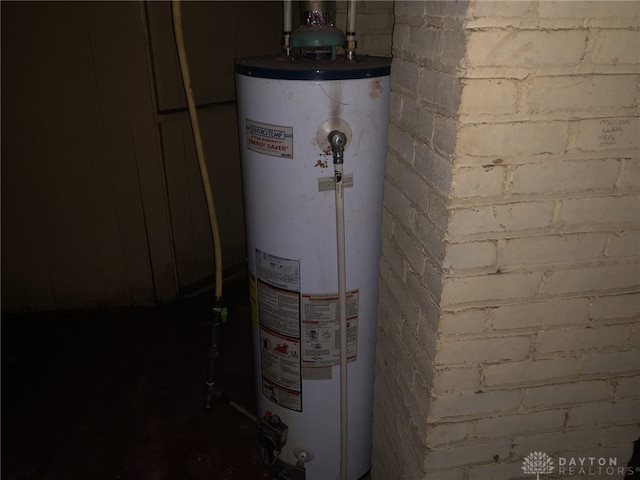 utility room with gas water heater