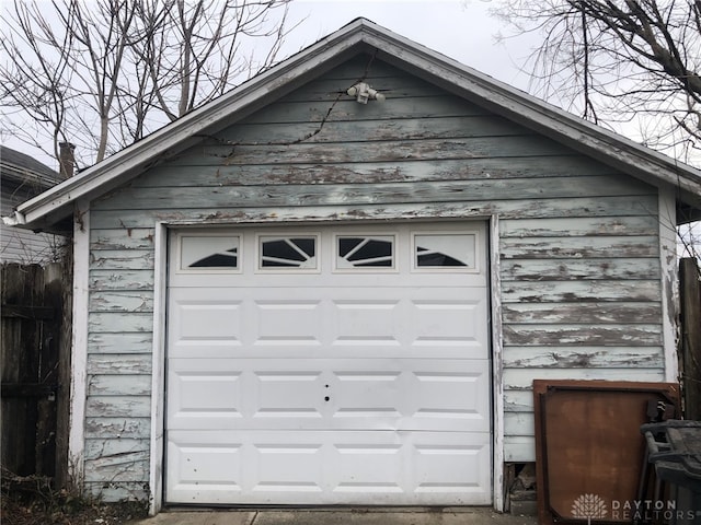 detached garage with fence