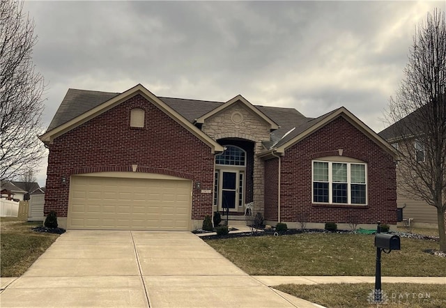 view of front of home featuring concrete driveway, stone siding, roof with shingles, an attached garage, and brick siding