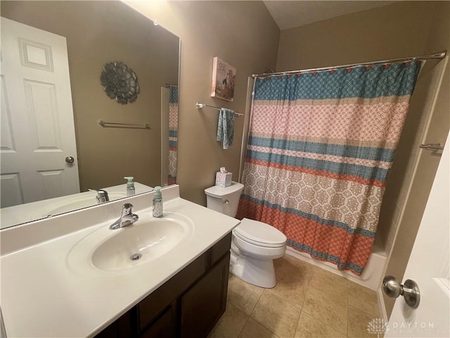 full bathroom featuring shower / bath combo, vanity, toilet, and tile patterned floors