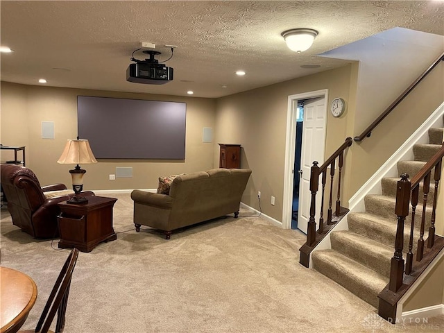 home theater room with light carpet, a textured ceiling, recessed lighting, and baseboards