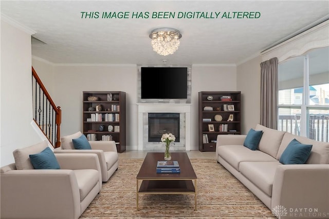 living room featuring a chandelier, a glass covered fireplace, crown molding, and stairway