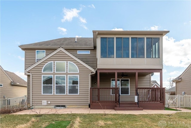 back of house with a ceiling fan, fence, a patio, and a lawn