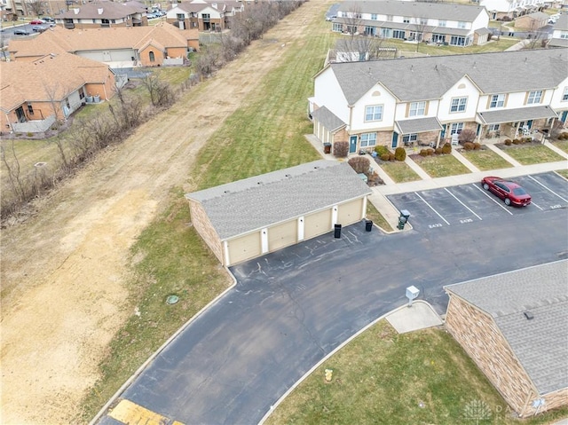 birds eye view of property with a residential view