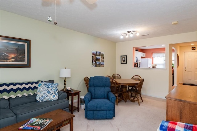 living room featuring light carpet