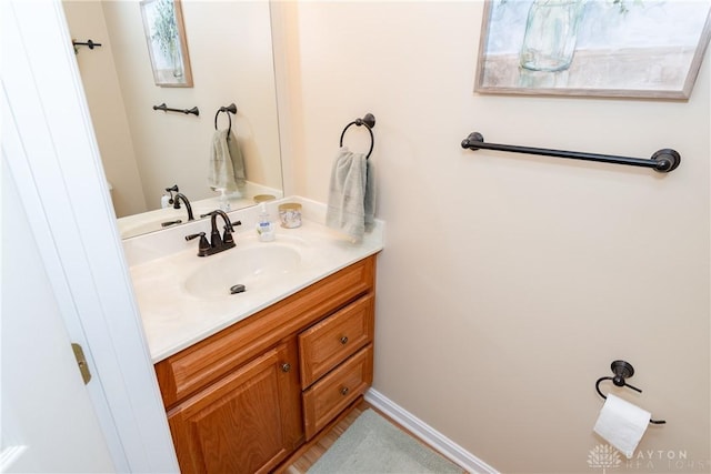 bathroom featuring vanity and baseboards