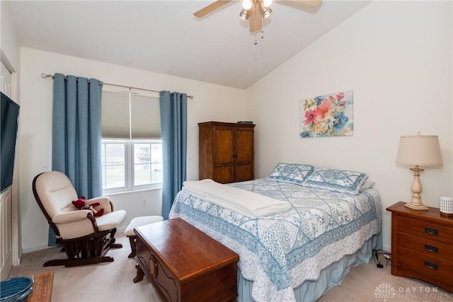 bedroom featuring carpet, vaulted ceiling, and ceiling fan