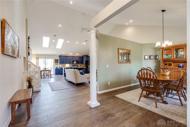 dining room with decorative columns, baseboards, dark wood finished floors, a chandelier, and high vaulted ceiling