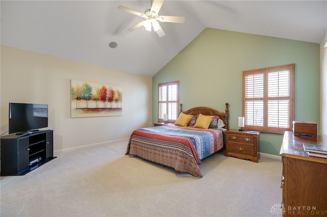 carpeted bedroom with high vaulted ceiling, ceiling fan, and baseboards