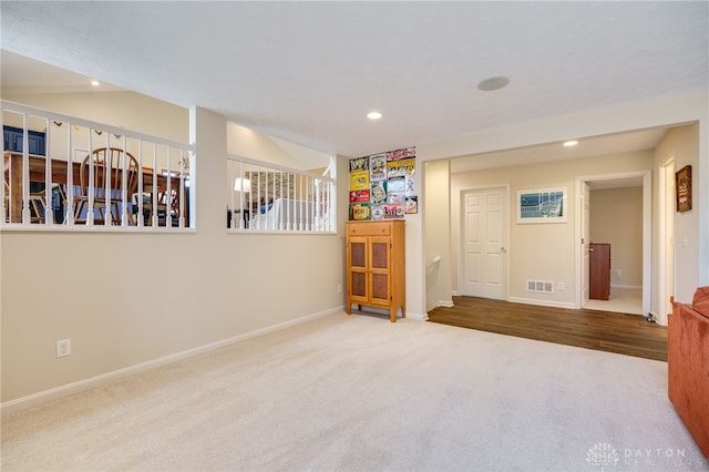 empty room featuring stairway, carpet, baseboards, and recessed lighting