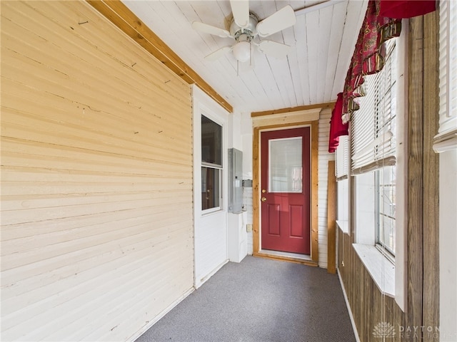 entrance to property with a ceiling fan