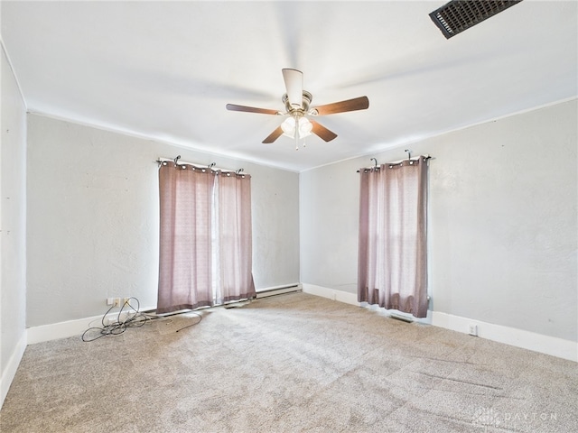 empty room featuring carpet floors, ceiling fan, and baseboards