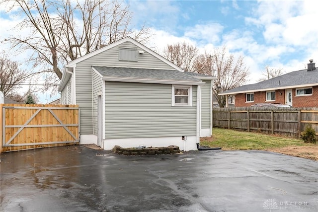 exterior space with a gate and fence