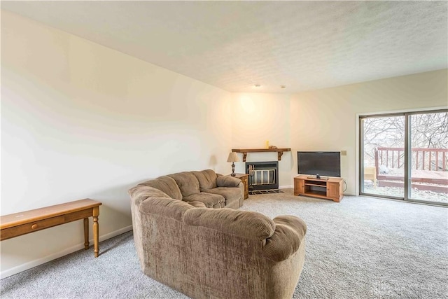 living room featuring a fireplace with flush hearth, light carpet, and baseboards