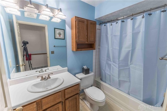 full bath featuring shower / tub combo, vanity, toilet, and tile patterned floors