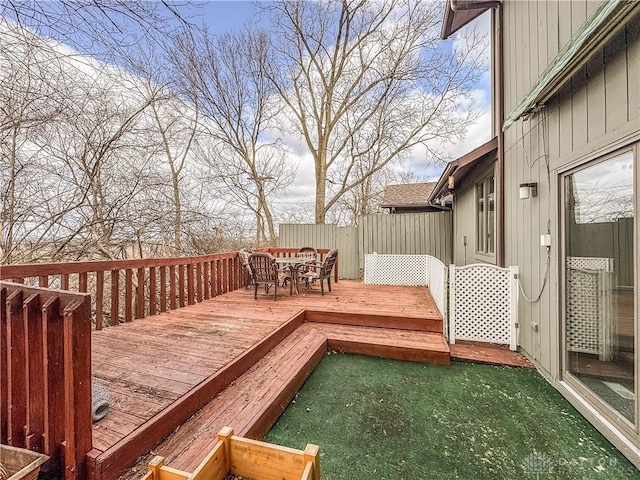 wooden terrace featuring outdoor dining space