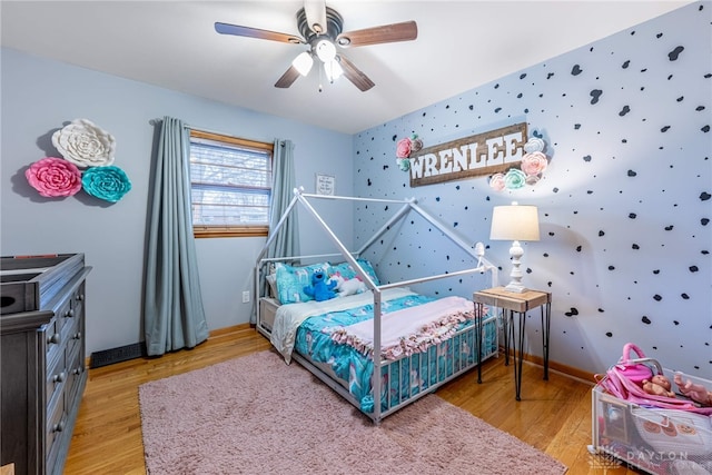 bedroom featuring ceiling fan and wood finished floors