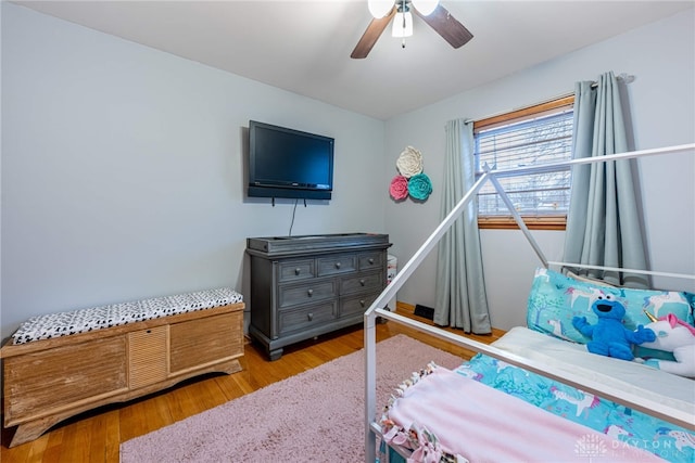 bedroom featuring wood finished floors and a ceiling fan