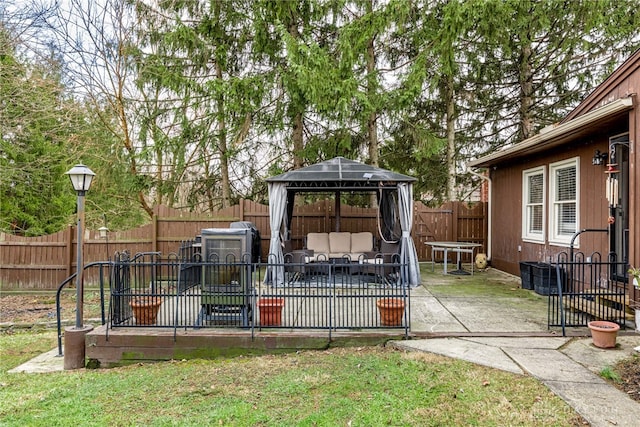 view of yard with a patio area, a fenced backyard, outdoor lounge area, and a gazebo