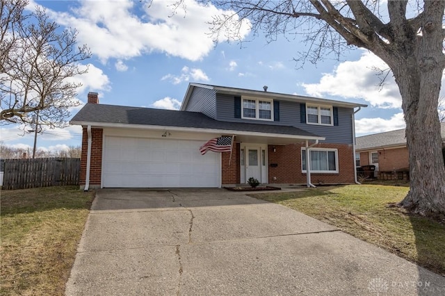 traditional home featuring a garage, a chimney, fence, and a front yard