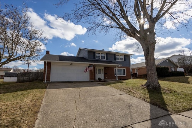 traditional-style home with a garage, brick siding, a chimney, fence, and a front yard