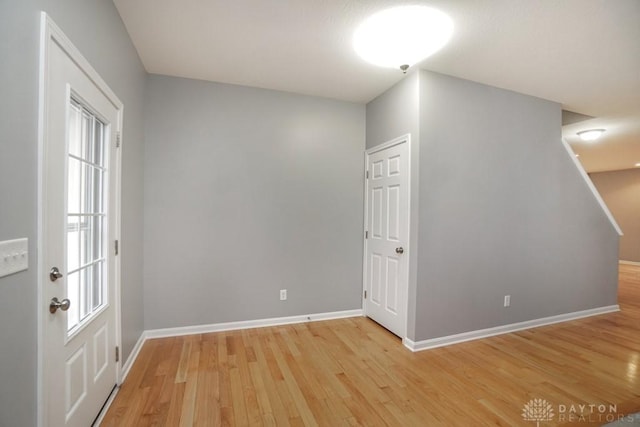 interior space with light wood-style flooring and baseboards