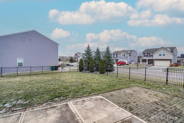 view of yard featuring a residential view and fence