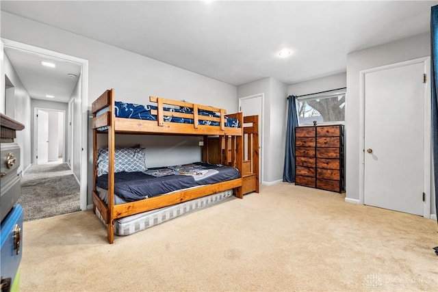 bedroom featuring carpet floors and baseboards