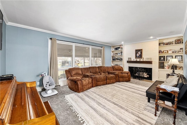 living area featuring carpet floors, a large fireplace, built in shelves, and crown molding