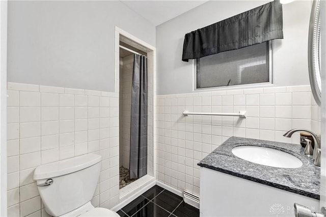 full bath featuring toilet, tile walls, a shower stall, and vanity