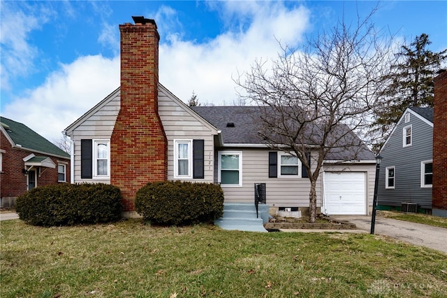 view of front facade with a chimney, an attached garage, central AC, driveway, and a front lawn