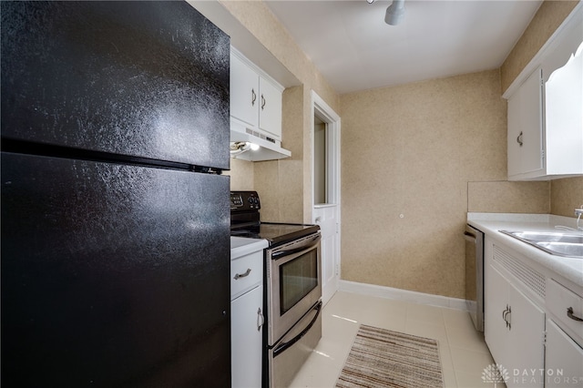 kitchen featuring stainless steel appliances, light countertops, white cabinetry, a sink, and under cabinet range hood