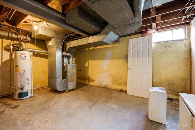 below grade area featuring water heater and heating unit