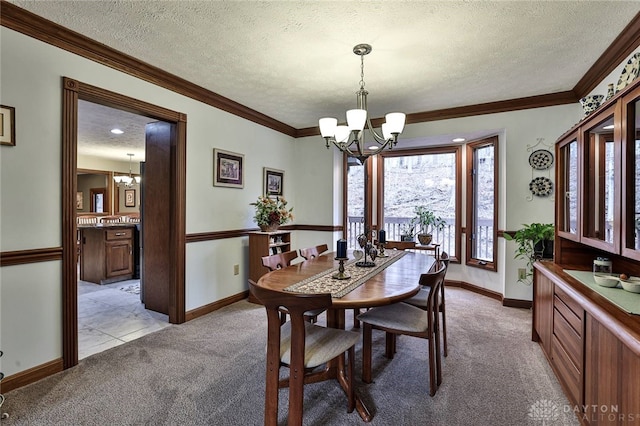 439 Claxton Glen Ct, Dayton, OH 45429 - dining room featuring a chandelier, light carpet, a textured ceiling, baseboards, and ornamental molding