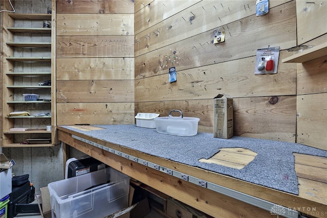 miscellaneous room with wood walls