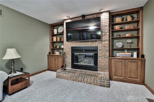 living room featuring carpet flooring, a fireplace, a textured ceiling, and baseboards