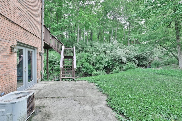439 Claxton Glen Ct, Dayton, OH 45429 - view of yard featuring a patio area, central AC, french doors, and stairway