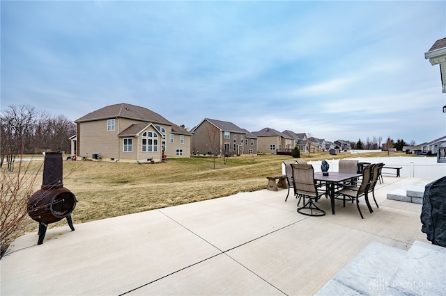 view of patio / terrace featuring a residential view and outdoor dining space