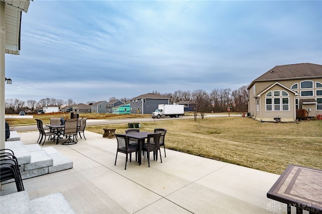 view of patio / terrace featuring a residential view and outdoor dining space