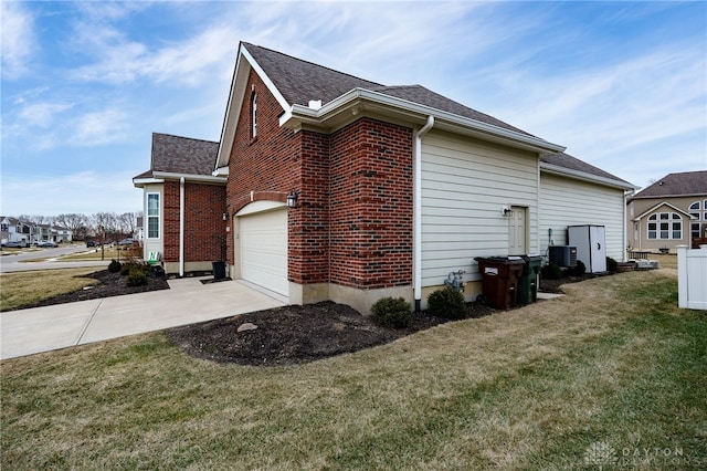 view of home's exterior featuring an attached garage, a lawn, concrete driveway, and brick siding