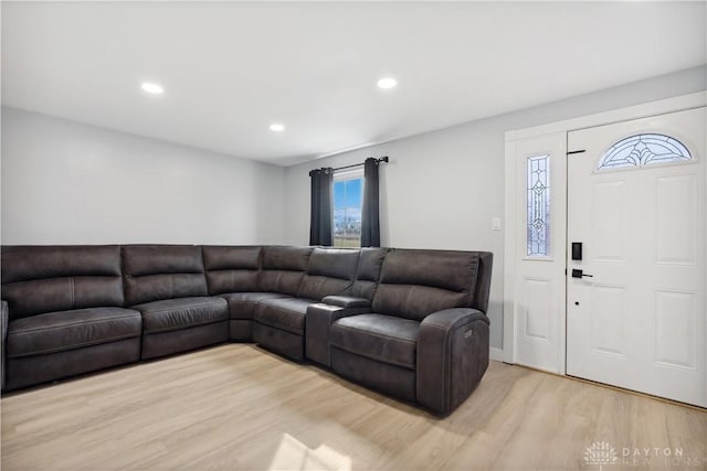 living area with recessed lighting and light wood finished floors