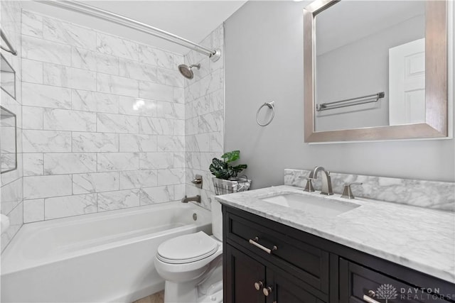 full bath with washtub / shower combination, vanity, and toilet