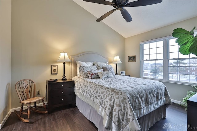 bedroom featuring dark wood-type flooring, vaulted ceiling, baseboards, and a ceiling fan