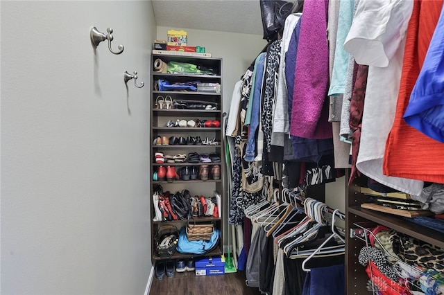 spacious closet featuring wood finished floors