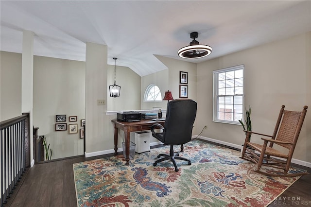 office area featuring vaulted ceiling, baseboards, and wood finished floors