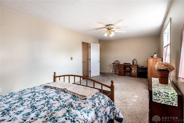 carpeted bedroom with a ceiling fan