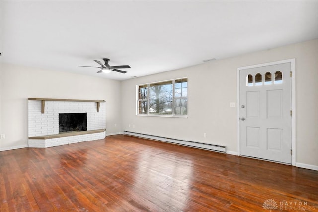 unfurnished living room featuring a baseboard heating unit, a fireplace, hardwood / wood-style flooring, and a ceiling fan