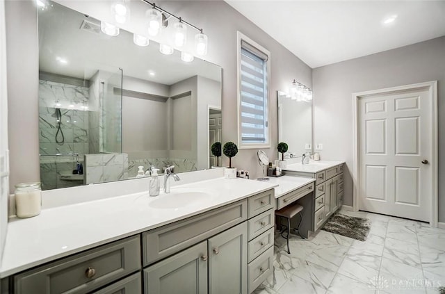 bathroom with marble finish floor, a marble finish shower, and vanity