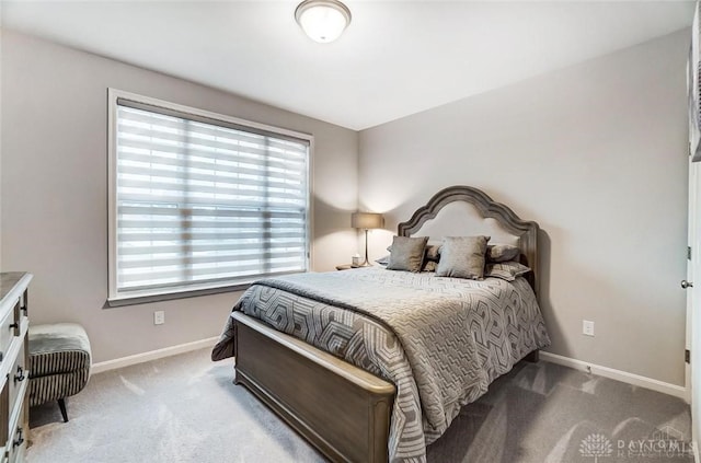 bedroom featuring carpet flooring and baseboards